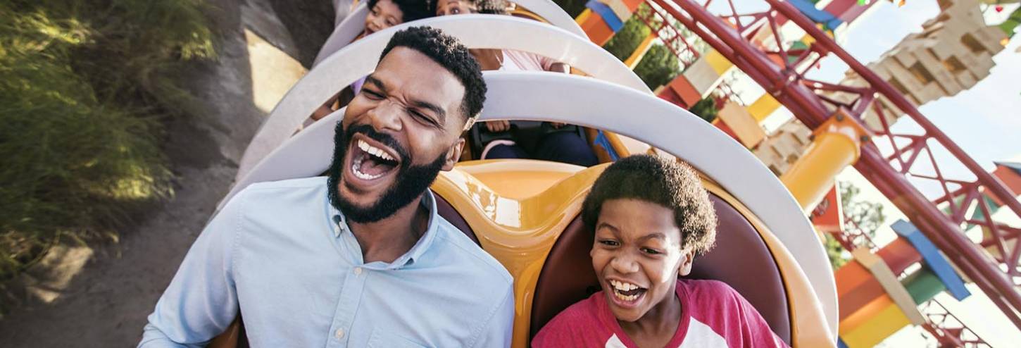 Dad and son on slinky ride at Disney Hollywood Studios